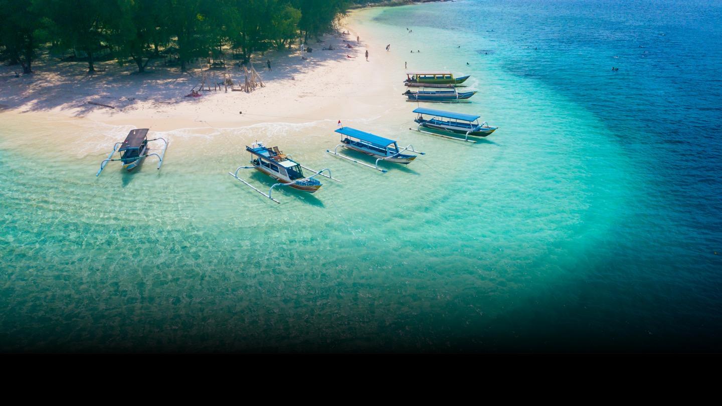Aerial beach view, boats docked on sand